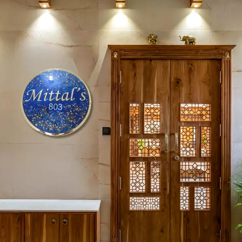 Round ocean resin nameplate beside a front door