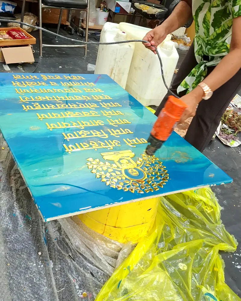Heat gun used to remove air bubbles from a resin mantra frame